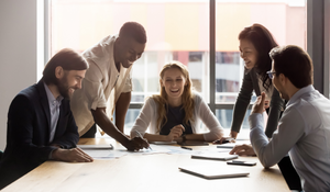 diverse employees engaged in team meeting